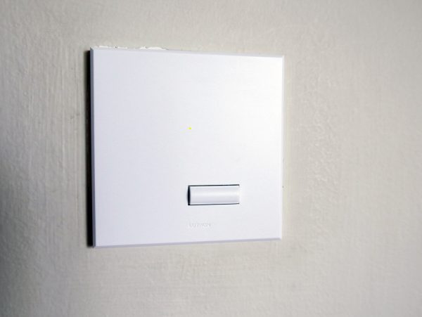 A Lutron wireless switch replaces a regular switch on the wall to make the lights "smart" in a room. PHOTO: Alfred Siew