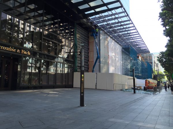 In September 2015, the hoarding has come down, while the floor-to-ceiling glass wall is up.